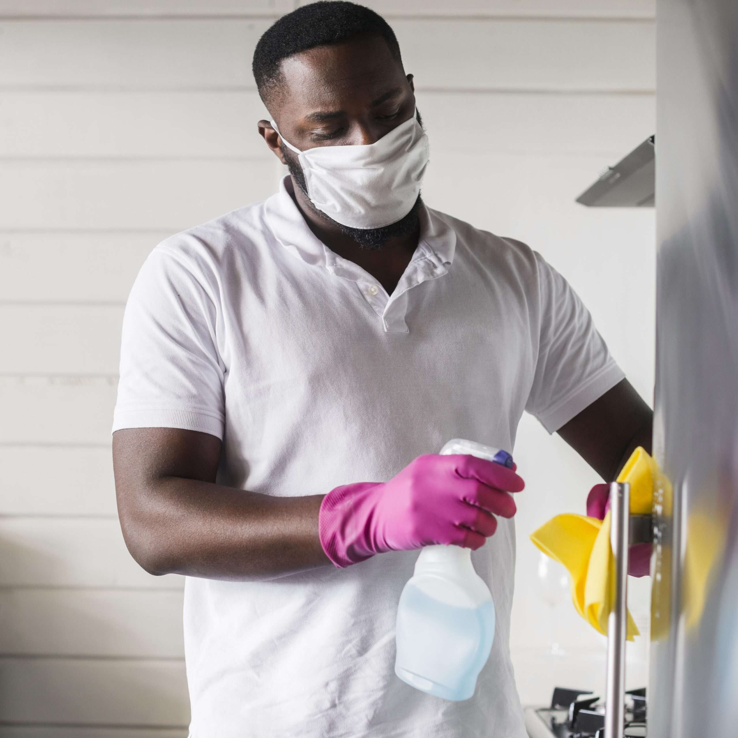 portrait-adult-male-disinfecting-house
